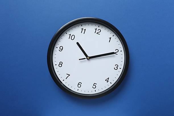 istock Big beautiful stylish clock on color background 2253463405
