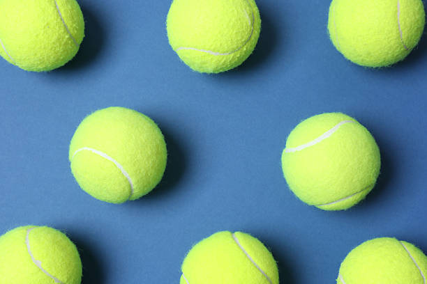 istock Tennis balls on color background 2253463452