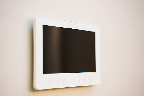 istock Smart device mounted on a wall in a modern room 2253465134