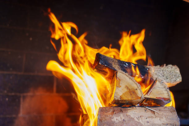 istock Fire burns wood in fireplace during evening hours 2253466574