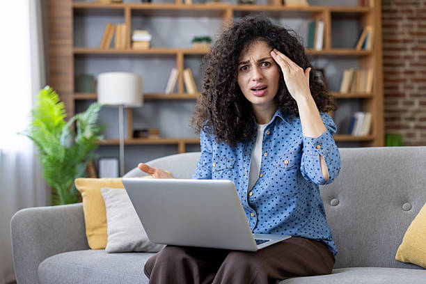 istock Woman experiencing frustration and stress while working on laptop 2253469889