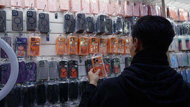 istock Customer looking at mobile phone cases in the electronics shop. 2253469995