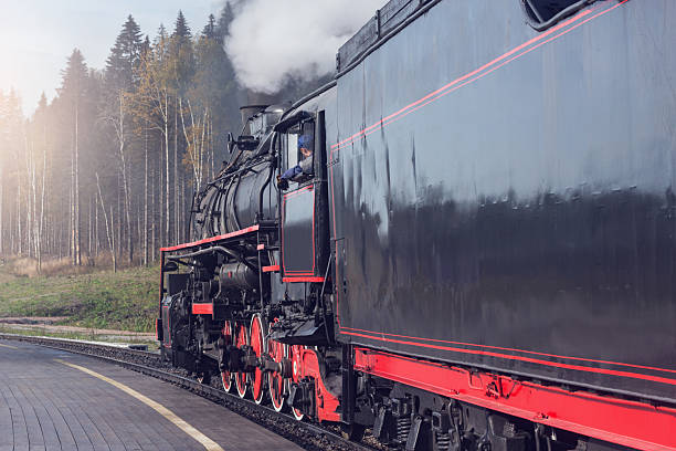 istock Steam train arrives to the platform. 2253470208