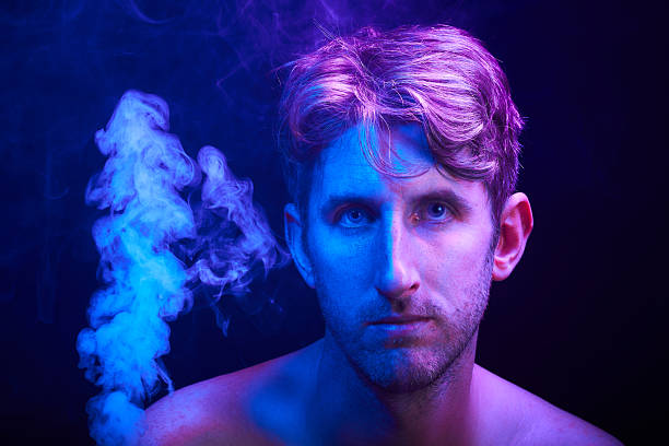 Bathing in purple light and smoke