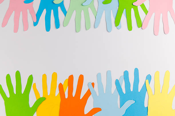 istock Paper hands forming a border on white background for Human Rights Day with copy space for text and social justice awareness messaging. 2253472083