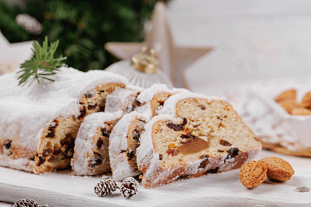 istock Christmas Stollen Loaf with Almonds and Ornaments 2253476270