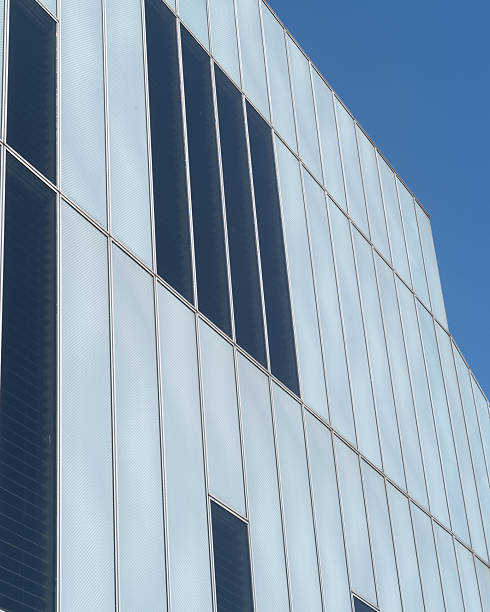 istock Modern building with reflective windows under a clear blue sky at midday 2253478533