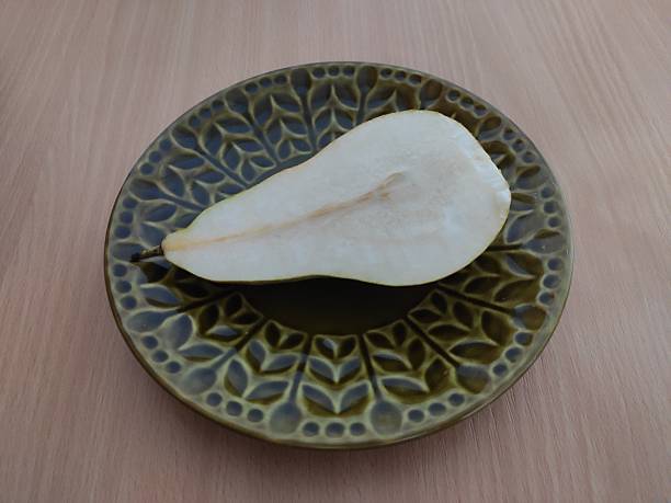 istock Fresh pear on the wooden table 2253478926