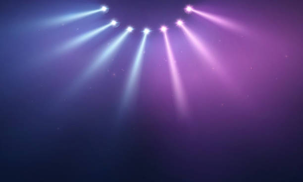 istock Stage lights illuminating a blue purple concert background 2253479622