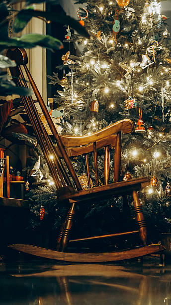 istock Rocking chair in festive home interior with Christmas tree 2253482689