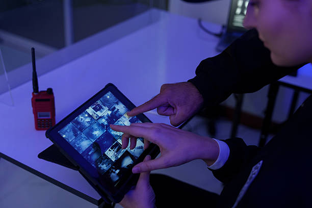 istock Security officers are checking the TV screen of the CCTV system. ( PHOTO ) 2253485652