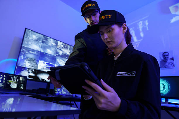 istock Security officers are checking the TV screen of the CCTV system. ( PHOTO ) 2253485661