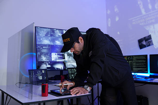 istock Security officers are checking the TV screen of the CCTV system. ( PHOTO ) 2253485686