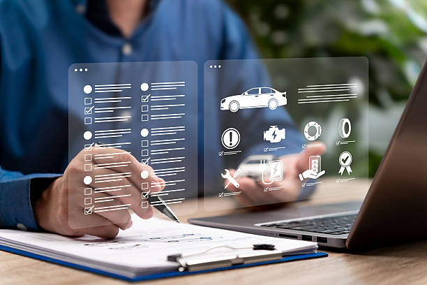 istock Car Service Maintenance Checklist Concept, Auto Service Technician Reviewing Vehicle Inspection Document for Scheduled Maintenance, Safety Check, Repair Plan, Brake, Tire, Electrical System Service 2253485883