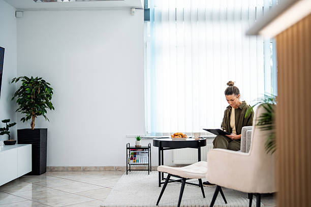 istock Caucasian Woman Engaging with Form in Peaceful Spa Lounge 2253486331