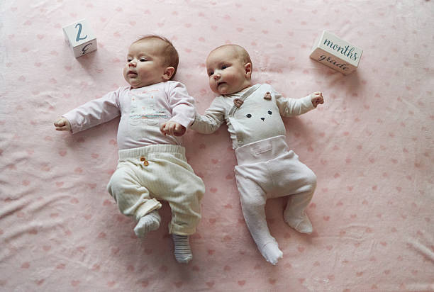 Infant  sleeping on Carpet . Newborn Babies  Sleep in Bed. Lovely sleep of the newborns babies on the bed. Cute baby boy is shooting in the studio. fashion image of baby and family.