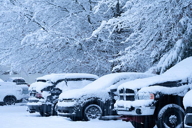 Worcester, USA - December 14, 2025. Community parking lot at Center Point Farm with cars covered with snow, Worcester, Pennsylvania, USA