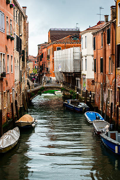 Old Houses And Canal In Title Style In Venice