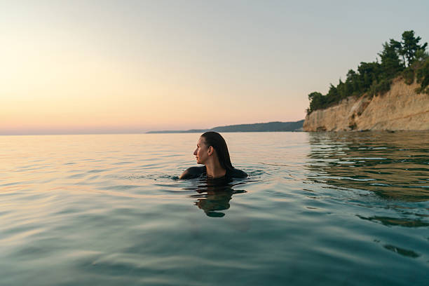 istock Swimming in the calm sea water 2253495413