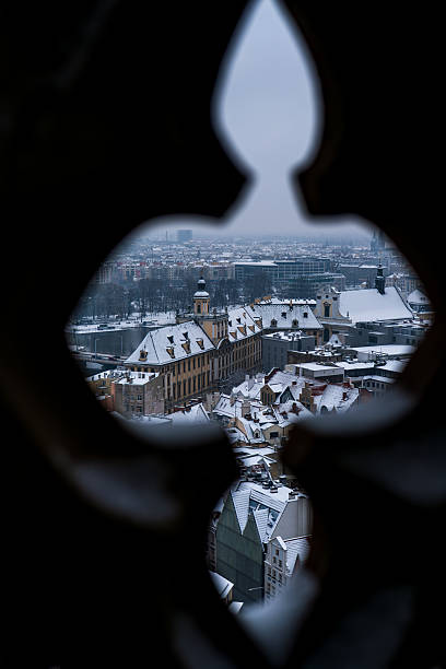 istock Wroclaw Old Town through quatrefoil opening with University view 2253496211