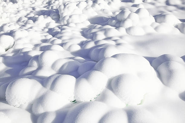 istock Soft snowdrifts forming rounded shapes under bright winter light creating clean background 2253497417