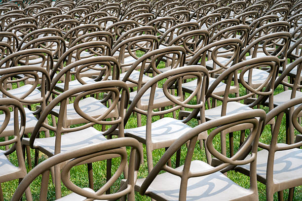 Floating Wooden Chairs in Surreal Bright Interior Scene. 3D Render