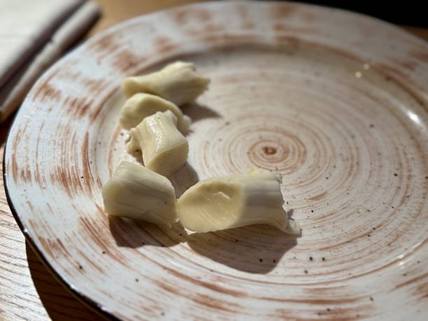 istock Plate With Bread Pieces And Crumbs, Minimal Serving, Soft Texture, Ceramic Rim, Wooden Table Surface, Warm Ambient Light, Inviting Rustic Snack Presentation, Closeup Detail 2253498861