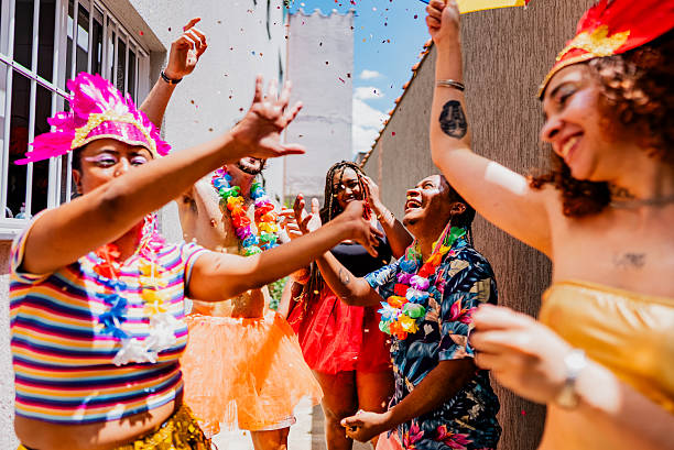 istock Excited friends dancing and enjoying Carnival at home 2253499521