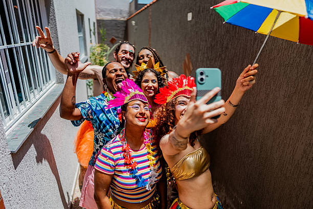 istock Excited friends taking a selfie during Carnival Celebration at home 2253499616