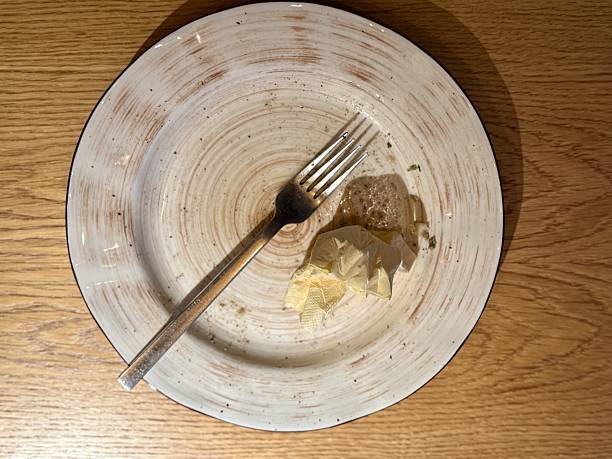 istock Two Empty Plates With Fork Napkin, Overhead View, Glass And Cutlery, Rustic Wood Tabletop, Mild Crumbs, Intimate Setting Suggesting Companionship, Soft Ambient Glow, Lingering Conversation 2253500769