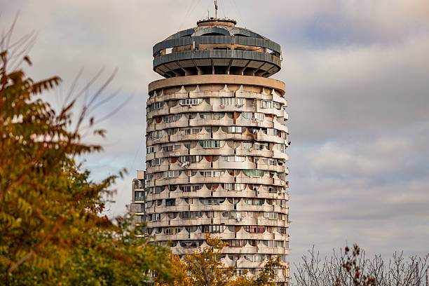 Romanita Tower, also known as the Corn Cob building, standing tall against a cloudy autumn sky, showcasing Soviet brutalist architecture and urban development in Chisinau, Moldova