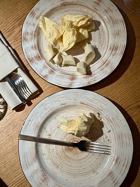 istock Two Empty Plates With Fork Napkin, Overhead View, Glass And Cutlery, Rustic Wood Tabletop, Mild Crumbs, Intimate Setting Suggesting Companionship, Soft Ambient Glow, Lingering Conversation 2253502018