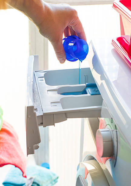 istock process of adding laundry detergent to modern washing machine tray 2253502968