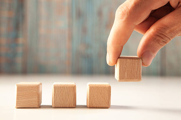 istock business strategy concept. wooden cubes in hand 2253504149