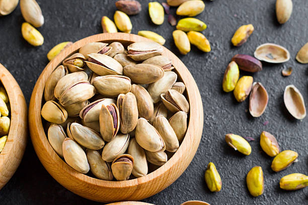 istock Pistachios are designed in a bamboo bowl 2253506550
