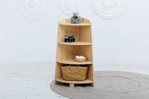 istock A wooden shelf that features a decorative basket on the bottom shelf 2253506787