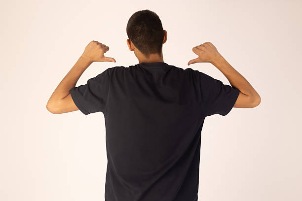istock Man in black t-shirt showing his back 2253506914