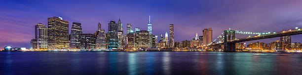 Manhattan Downtown urban view with Brooklyn bridge at night