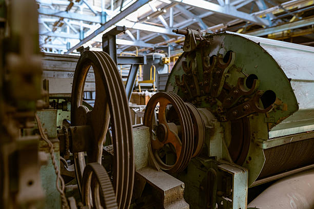 istock Heavy industrial machine gears and pulleys 2253510437
