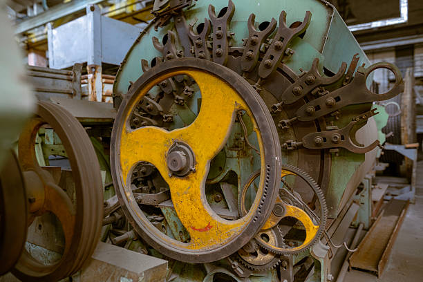 istock Large yellow flywheel on industrial machine 2253510457