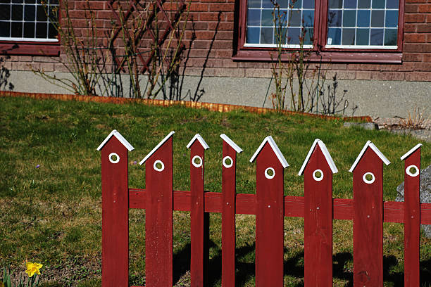 Roses flowerbed inside a white wooden fence. Holmsbu, Norway.