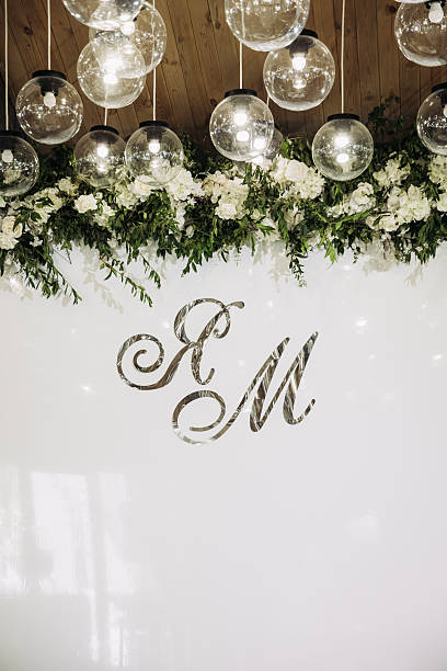 istock Discover Elegant Wedding Decor featuring Exquisite Floral Arrangements and Custom Initials 2253521664