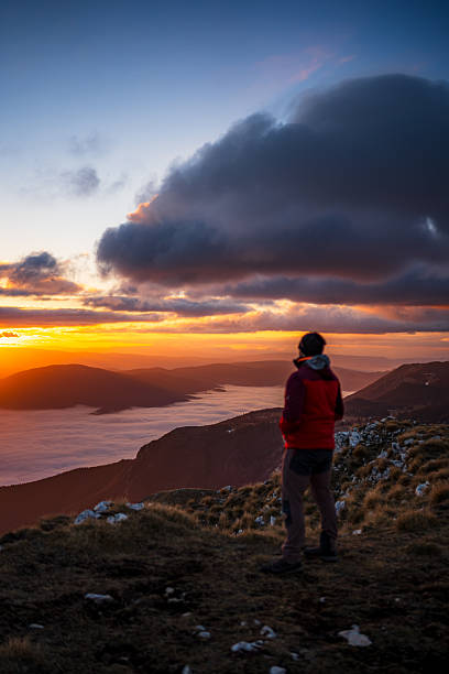istock Mountaintop View of Sunset Over Expansive Fog and Distant Mountain Layers 2253522031
