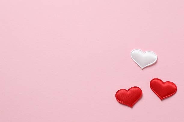 istock Beautiful hearts on pink background 2253522307