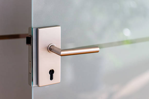istock Modern door handle on frosted glass door 2253524549
