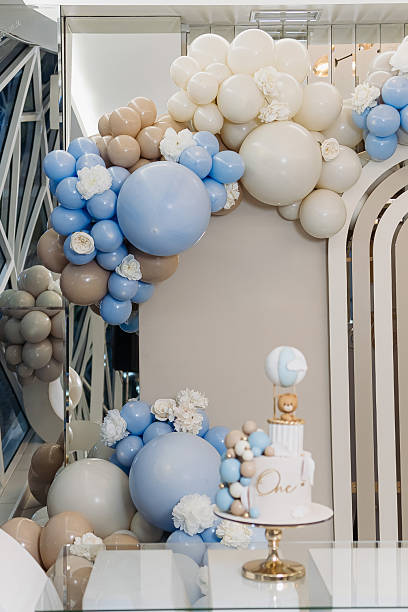 istock An elegant balloon decoration theme, combined with a beautifully arranged cake display, creates the perfect atmosphere for a memorable first birthday celebration that will be cherished forever 2253524605