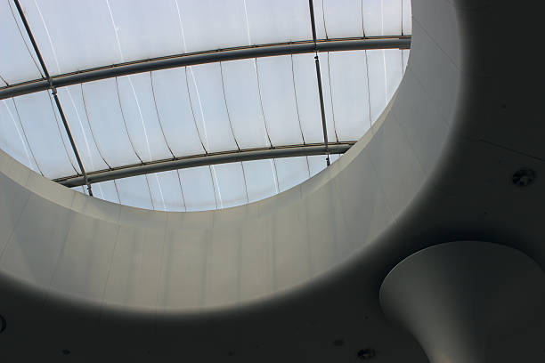 Futuristic design of a round porthole in the ceiling of a multi level building