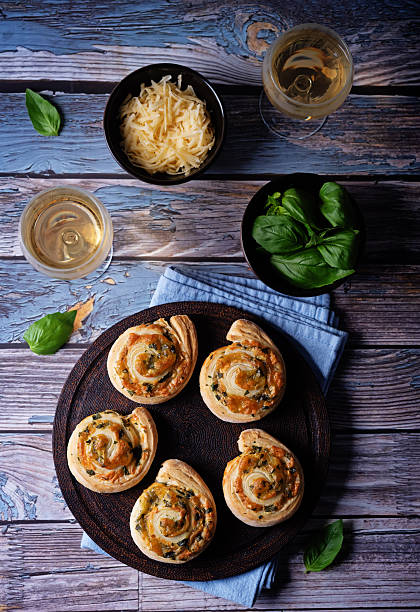 istock Basil garlic cheese roll cake pinwheel in a plate on a wood background 2253526478