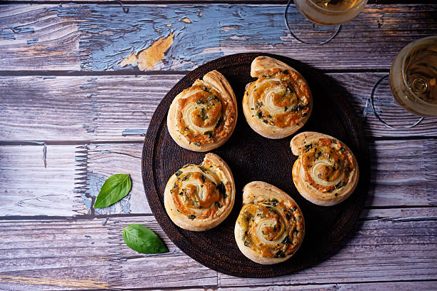 istock Basil garlic cheese roll cake pinwheel in a plate on a wood background 2253526479