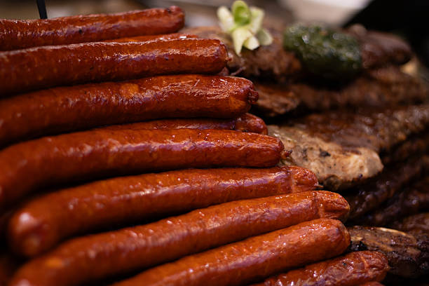 istock smoked sausages stacked with grilled meats 2253529318